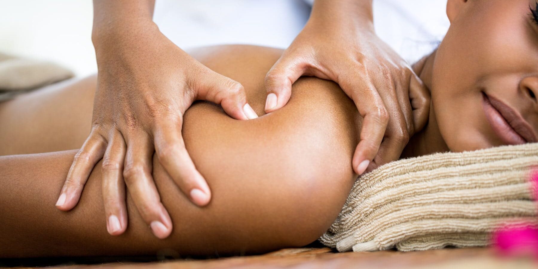 Close up of massager hands massage shoulder